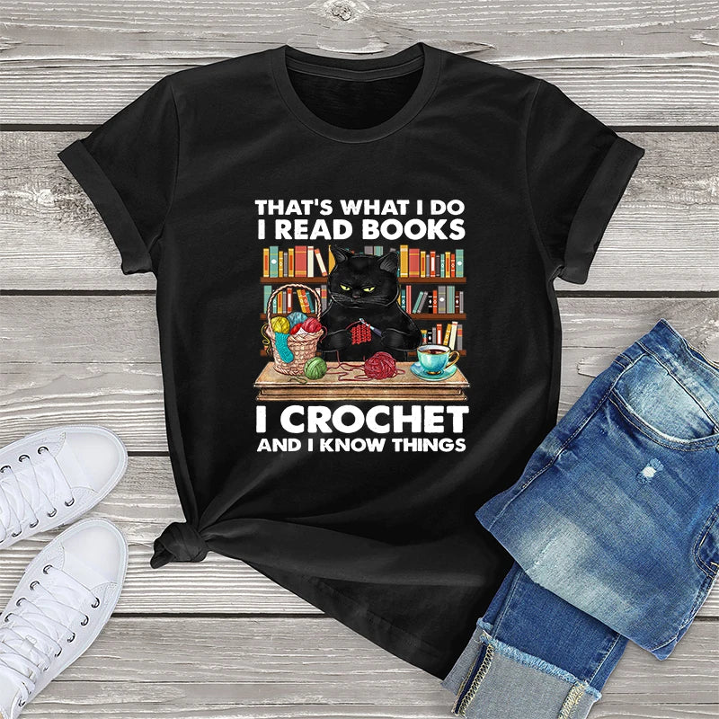 Cat Crocheting T-shirt: 'That's what I do. I read books, I crochet, and I know things' text