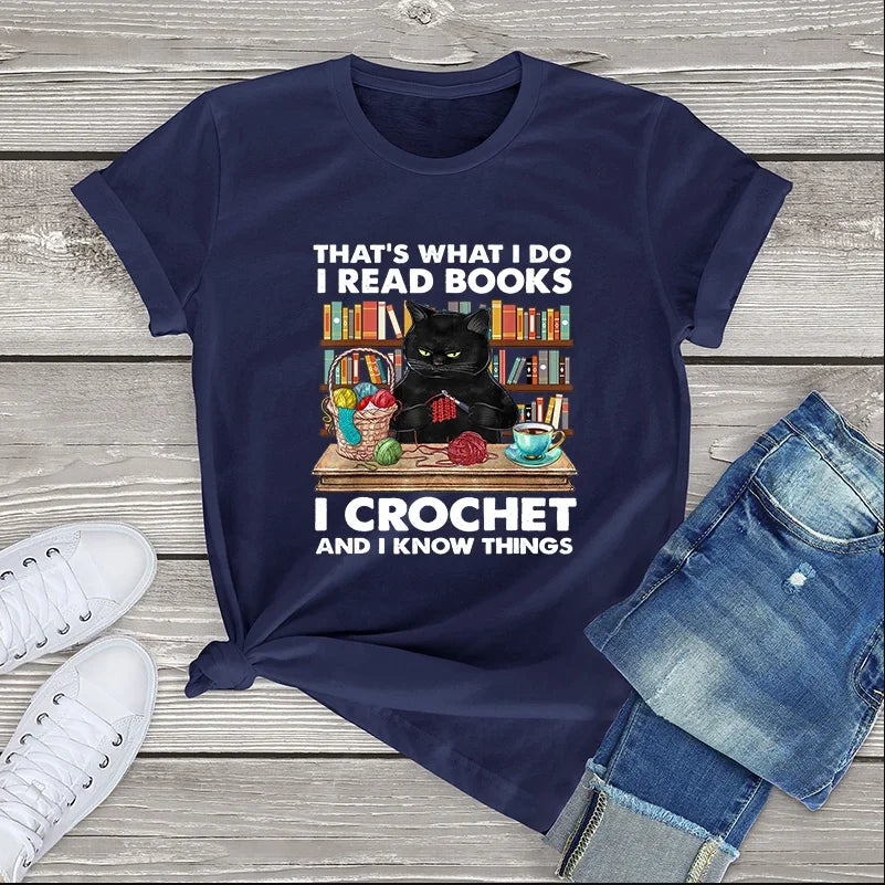 Cat Crocheting T-shirt: 'That's what I do. I read books, I crochet, and I know things' text